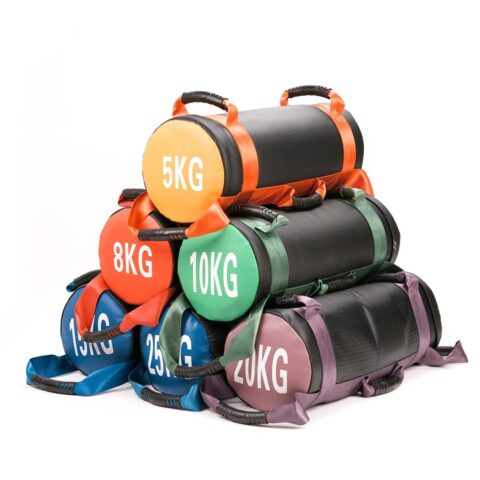 A cylindrical NF_10100_20 Energy Bag with reinforced handles on each side, designed for functional strength training. The bag features a durable, heavy-duty exterior with clear weight markings, and is ideal for exercises like squats, lunges, and presses in a gym or fitness studio setting
